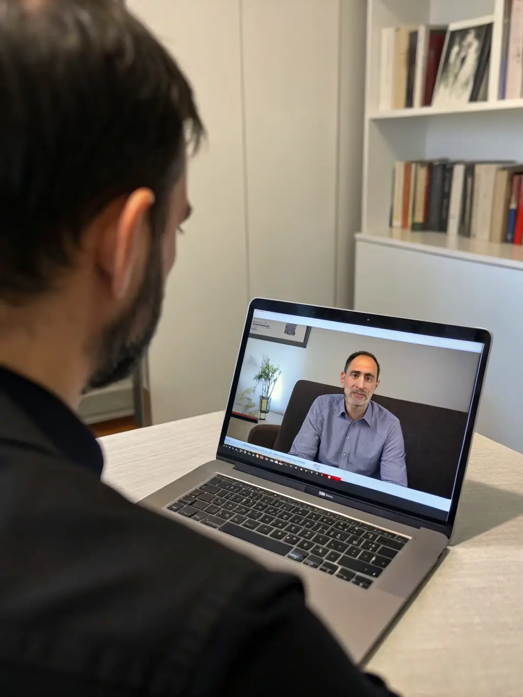 A candidate is participating in a video interview with a GoHire Staffing representative, emphasizing the importance of virtual communication.