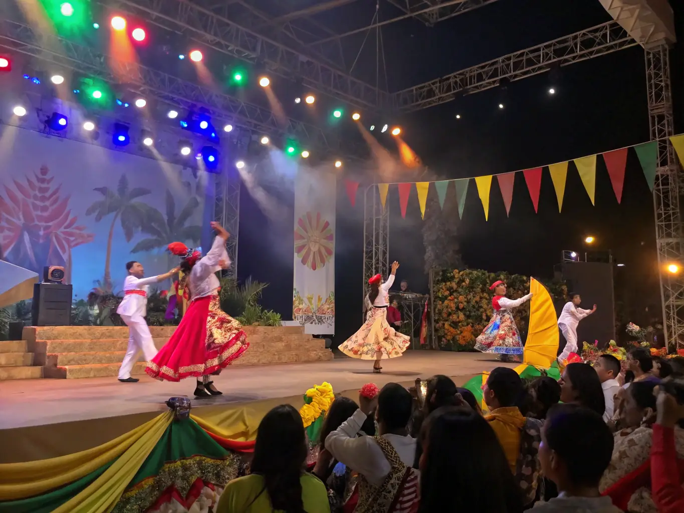 A vibrant stage performance with dancers and musicians, illustrating the entertainment industry and GoHire Staffing's role in sourcing talented performers and technical staff.